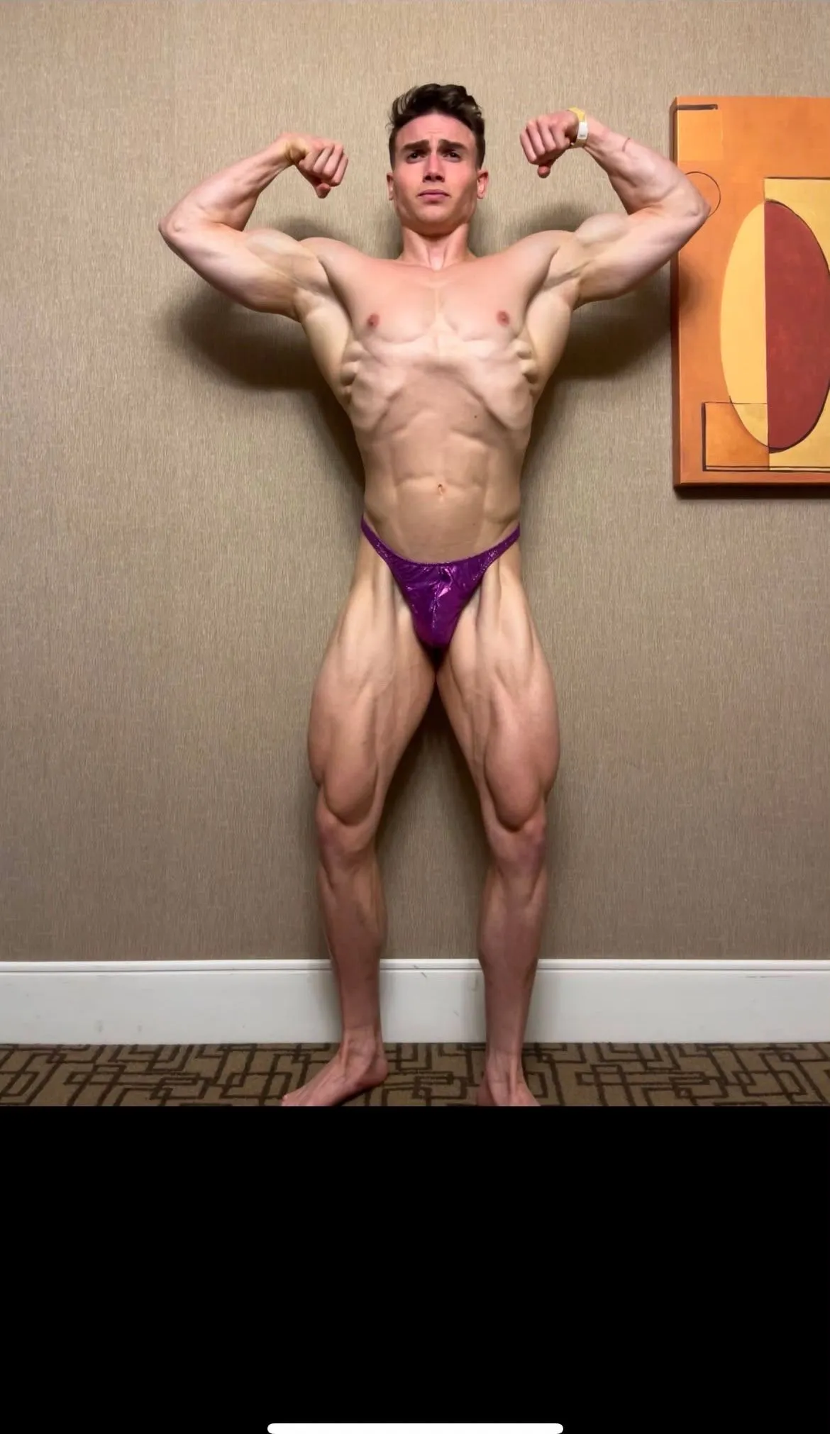 Nick Dosh, front double biceps at a contest-prep check-in